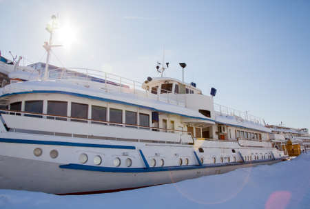Perm, Russia - March 11.2017: Fragment of river boat in the winter parking lot in the dockのeditorial素材