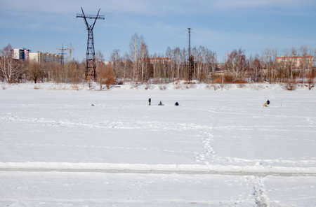 Perm, Russia - March 11.2017: Fishermen catch fish on a frozen river in winterのeditorial素材