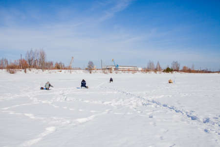 Perm, Russia - March 11.2017: Fishermen catch fish on a frozen river in winterのeditorial素材