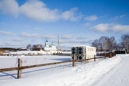 Village Sloboda,Sverdlovsk oblast, Russia  - March 01.2017: Cooling Chamber in winter on the background of George's Churchのeditorial素材