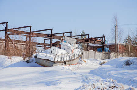 Perm, Russia - March 11.2017: An old boat on the snow in the backwaters of the Kama riverのeditorial素材