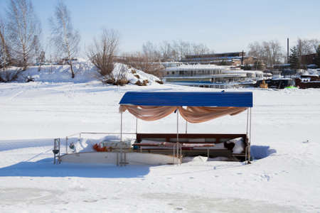 Perm, Russia - March 11.2017: Boat on a winter day in a frozen river on the territory of a yacht clubのeditorial素材