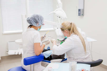 Perm, Russia - June 13.2017: Treatment of a teeth in stomatologic clinicのeditorial素材