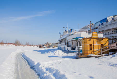 Perm, Russia - March 11.2017: Boats at the shipyard in the backwater of the Kama river in winterのeditorial素材