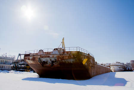 Perm, Russia - March 11.2017: Ships and barges on the shipyard in the backwater of the Kama River in winterのeditorial素材