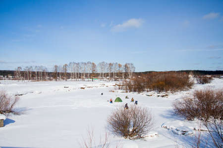 Russia, Sverdlovsk region, the village of Sloboda - March 01.2017: Fishermen in the winter on the river Chusovayaのeditorial素材