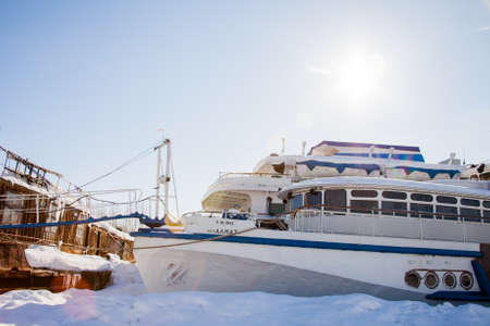 Perm, Russia - March 11.2017: Ships and barges on the shipyard in the backwater of the Kama River in winterのeditorial素材