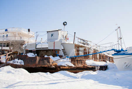 Perm, Russia - March 11.2017: Boats at the shipyard in the backwater of the Kama river in winterのeditorial素材