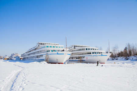 Perm, Russia-March 11.2017: Winter landscape with sailboats in the backwater of frozen river Kamaのeditorial素材