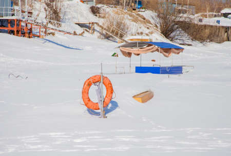Perm, Russia - March 11.2017: Boat on a winter day in a frozen river on the territory of a yacht clubのeditorial素材