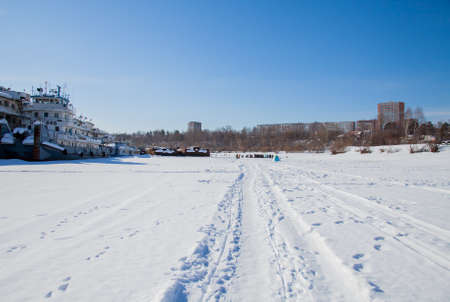 Perm, Russia - March 11.2017: Ships and barges on the shipyard in the backwater of the Kama river in winterのeditorial素材