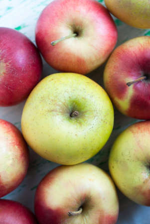 some apples lie on a wooden background. Shooting from the top