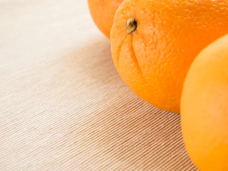 oranges lie on the old wooden background.
