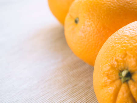 oranges lie on the old wooden background.の写真素材