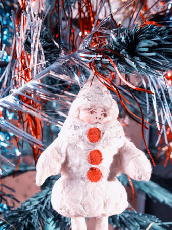 old rag Christmas toy on a branch. Vintage processingの写真素材