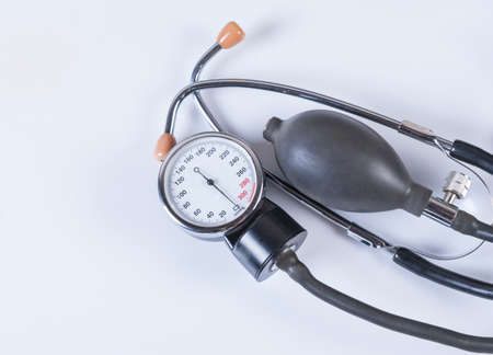 Tonometer and stethoscope on white background. Medical equipmentの写真素材
