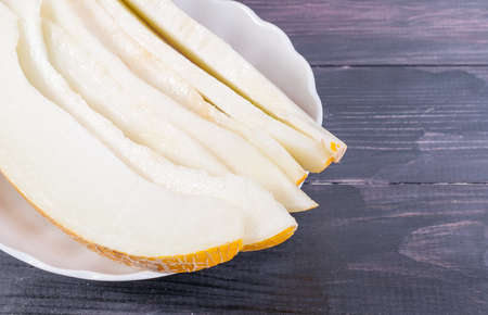 Cooking chunks of ripe melon on the plateの写真素材