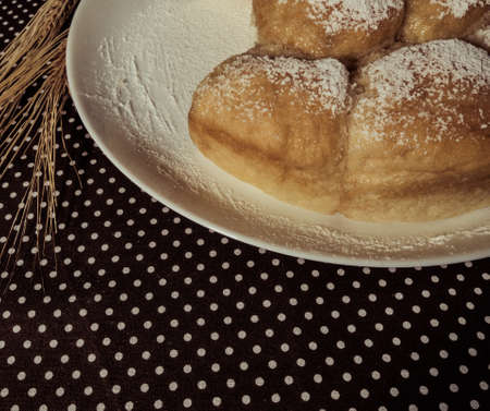 Still life of homemade baking wheat spikes on a table.の写真素材