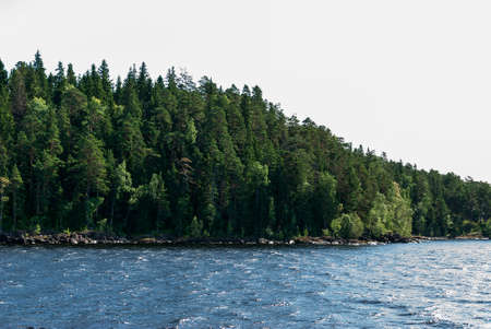 The trail waves and foam from the waves left by a passing shipの写真素材