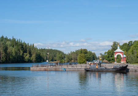 Jetty with boats and a chapel on the Wharfの写真素材