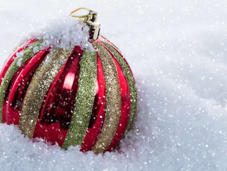 Christmas ball on snow. Close-up. New Year holiday backgroundの写真素材