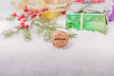 Cork from champagne with numbers on the background of New Year's gifts. Christmas background.の写真素材
