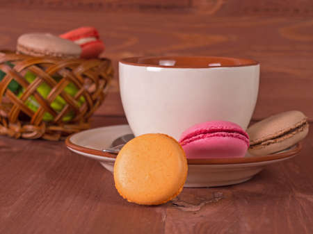 Cup with tea, cake on a wooden backgroundの写真素材