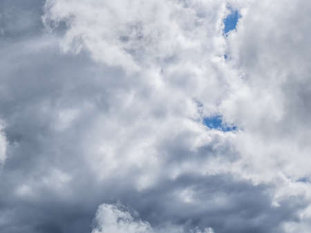 Cumulus clouds in the blue sky at sunset