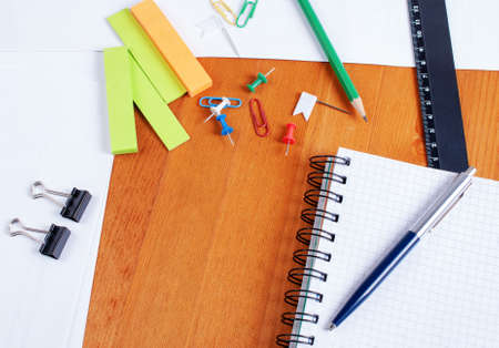 Office supplies on a wooden tableの写真素材
