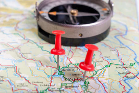 Map of Norway with marked city and compass in the background.の写真素材