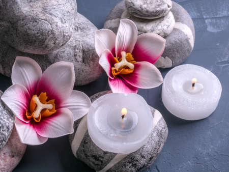 Candle, flowers and a towel. Spa compositionの写真素材