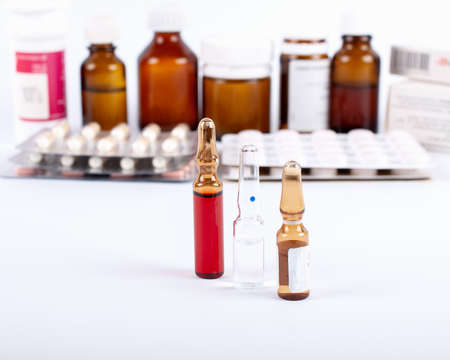 medicines stand on a table light background tablets
