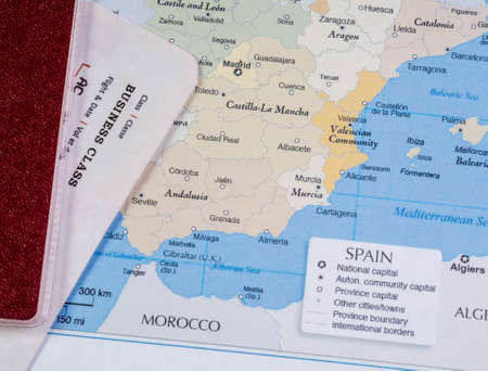 Passport and air ticket on the map of Spainの写真素材