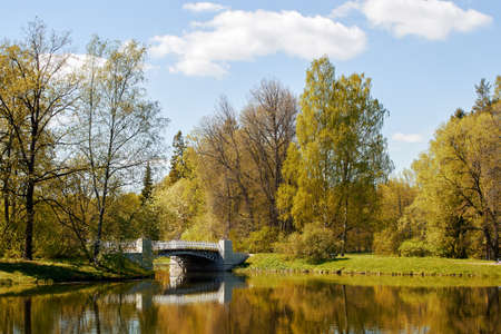 Stone bridge with delicate railing across the riverの写真素材