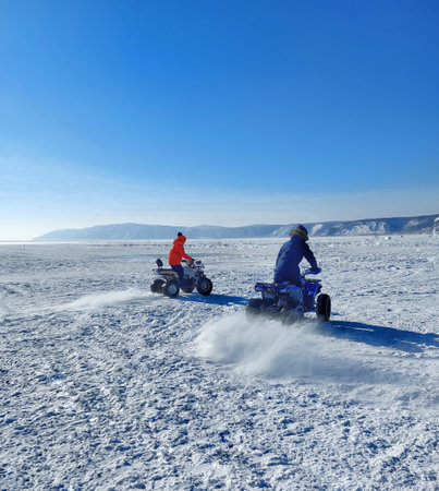 Snowmobiling on the frozen Lake Baikal, Siberia, Russiaの写真素材
