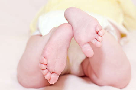 Little feet on the blanket, close-up, selective focus