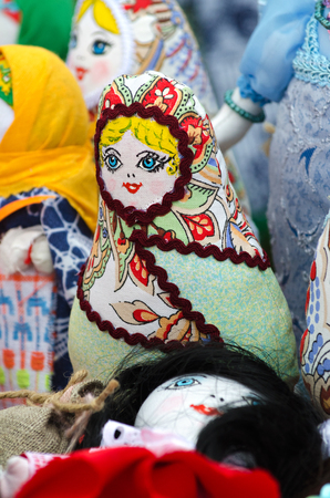Trade in the market, the traditional doll amulet in the form of dolls made from scraps of fabric. Selective focus.の写真素材