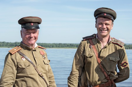 Historical festival of the Second World war in Samara to celebrate the Day of the Navy, July 26, 2015. Portrait of two soldiers of the red Army on the Volga.のeditorial素材