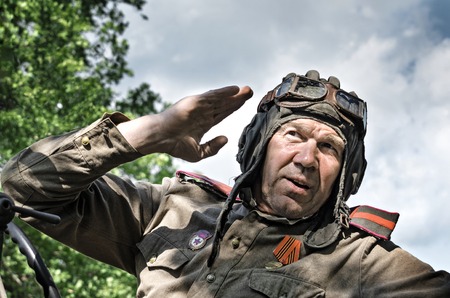 Historical festival in Mordovia, the Second World war, Russia, July 4, 2015. Portrait of a red army soldier, in the old helmet.のeditorial素材