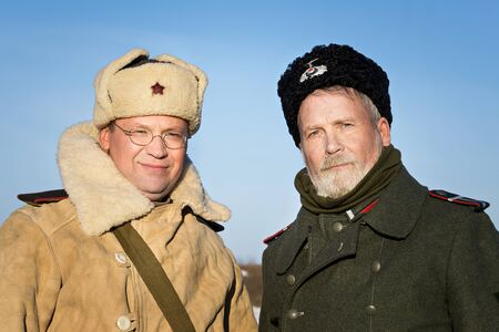 Festival of military history of Russia of XX century, Christmas maneuvers . Samara region, Togliatti, 5 January 2018. Portrait of a soldier of the red Army and Cossack on the German side.のeditorial素材
