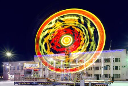 Colorful carousel in the night Christmas town. Russia, Ulyanovsk region, Dimitrovgrad 30 December 2016.のeditorial素材