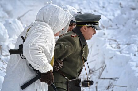 Reconstruction of the events of world war II, red army scouts are a captured German officer. Russia, Samara February 28, 2015.のeditorial素材