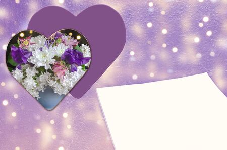 Hearts in colors and blank paper on a textured wooden background with bokeh. Concept of Valentine's day and Mother's day holidaysの写真素材