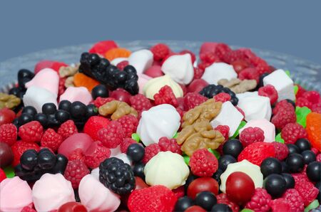 Scented bath soap in the shape of berries and sweets on a tray. Body care concept