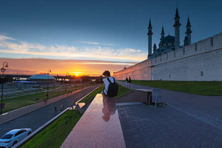 The wall of the Kazan Kremlin outside, illuminated by the sunset, people on a walk. Russia, Kazan 24 June 2019のeditorial素材
