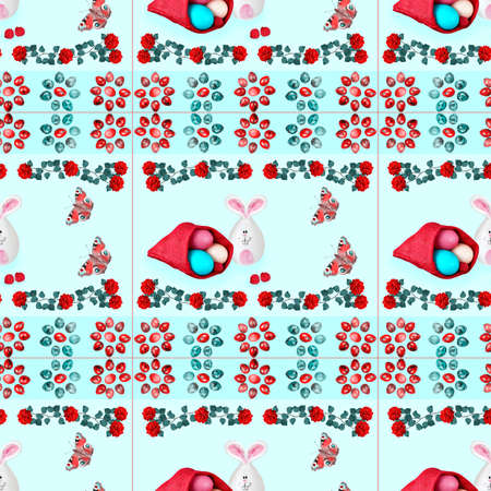 Easter seamless pattern with eggs, flowers, butterflies and a toy rabbit on a light square backgroundの写真素材