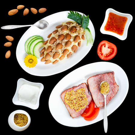 Seamless pattern with beautiful tasty appetizers, sauces and mustard, on a black square background. Roast pork and pineapple nut saladの写真素材