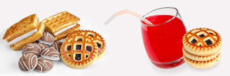 Various delicious cookies and fruit juice in a glass with a straw on a white widescreen background. Selective focus bannerの写真素材