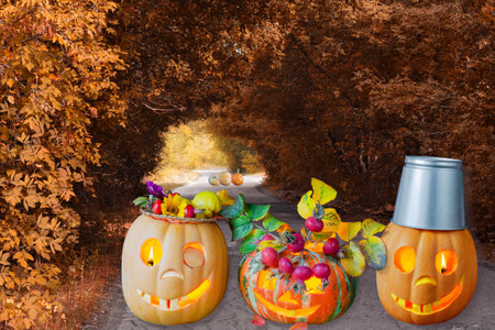 Halloween funny and terrible pumpkins are coming down the old road. Selective focusの写真素材