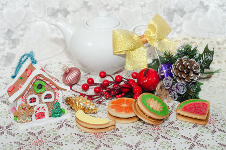 Preparing for the Christmas tea party. Beautiful cookies on a defocused festive background. Selective focusの写真素材